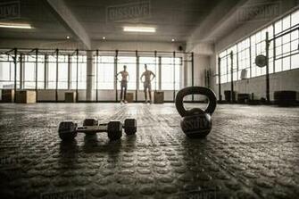 Two Fit People On The Background In Gym Stock Photo Dissolve