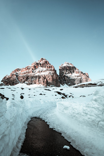 Snow Covered Mountain Under Blue Sky During Daytime Photo