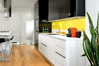 Kitchen With A Yellow Cake Painted Backsplash From Farrow And Ball