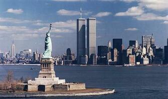 Of The Statue Liberty With World Trade Center In Background