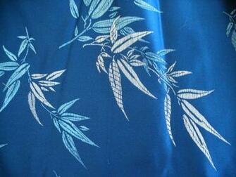Smooth Royal Blue Background With Metallic Silver And Bamboo