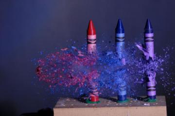 High Speed Photo Of Crayons Vs A Bullet Photography Wallpaper