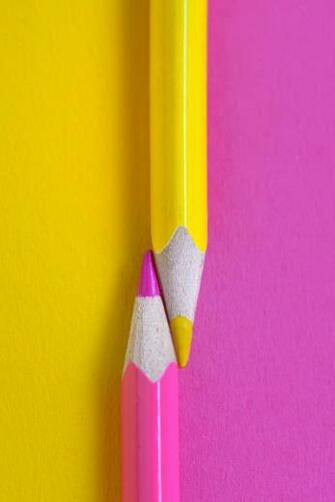 Yellow And Pink Crayons On The Same