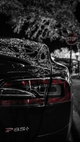 iPhone Wallpaper Tesla Under Christmas Lights Dark