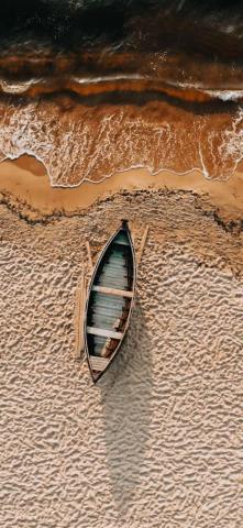 Brown And White Boat On Sand iPhone Wallpaper