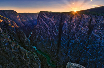 Explore The Depths Of Black Canyon A Deep And Beautiful Wallpaper