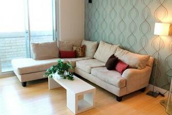 Single Wallpaper Accent Wall Adds A Unique Touch To This Living Room