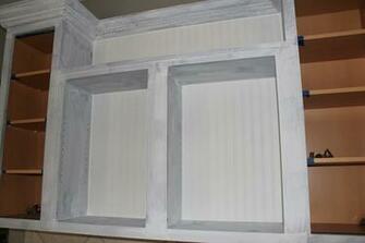 While I Worked On The Cabinet Doors Hubs Primed Cabinets