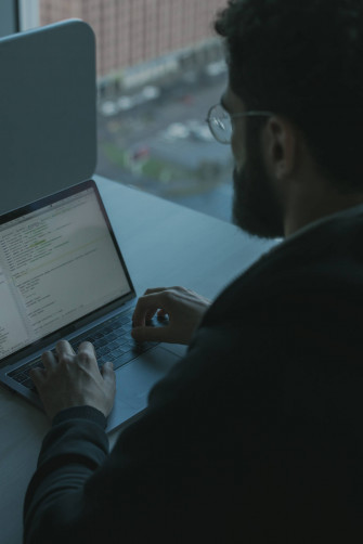 Engineer Typing On A Laptop 1pqr0g7ljerr5zvm Wallpaper