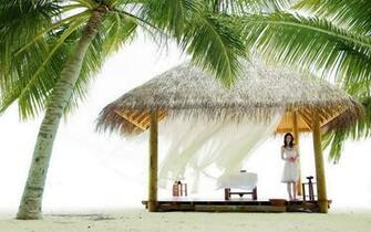 Woman In A Beach Hut Wallpaper