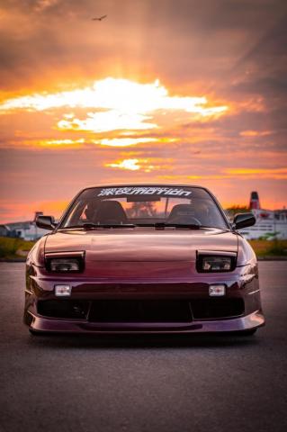 Red Chevrolet Camaro On Road During Sunset Photo Image