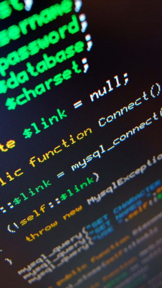 A Computer Screen With Lot Of Code On It Wallpaper