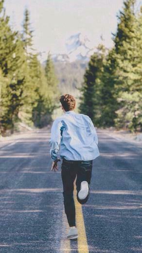 Handsome Young Man Running Street iPhone Wallpaper