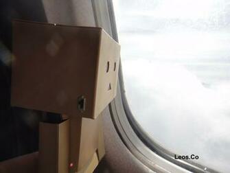 Danbo Looking Out Of A Plane S Window Wallpaper