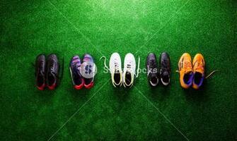 Various Colorful Cleats Against Artificial Turf Studio Shot On
