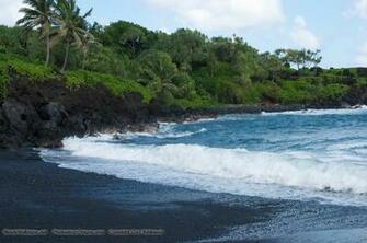 Waves Break On Shore Of This Black Sand Beach With Lush Tropical