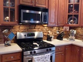 Modern Than Stainless Steel Appliances This Faux Stone Backsplash