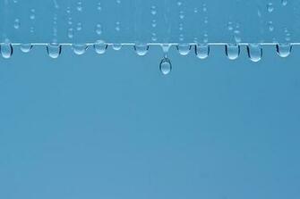 Rain Water Droplets Window Panes Blue Background Wallpaper