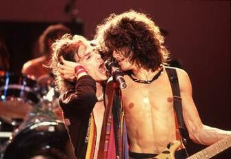 Classic Joe Perry Steven Tyler Concert Guitars Wallpaper Background