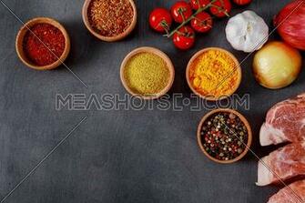 Raw Pork Meat Steaks Set Of Spices And Herbs On Black Background