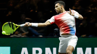 Professional Tennis Player Felix Auger Aliassime Performing A Wallpaper