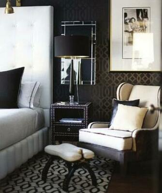 Lamp In Front Of A Mirror Over Nightstand Bedroom