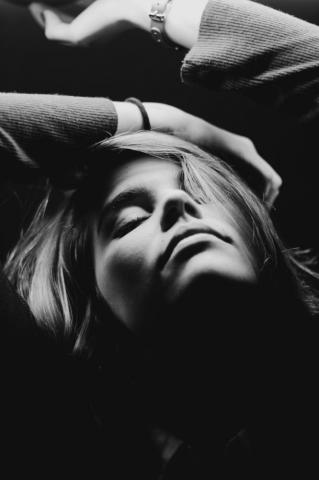 Grayscale Photography Of Closed Eyes Woman While Raising Hands