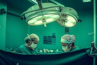 Two Person Doing Surgery Inside Room Stock Photo Image