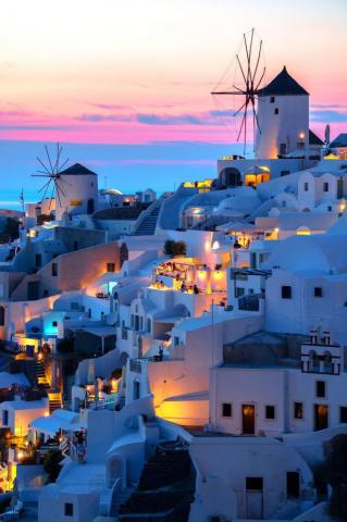 Sunset In Oia Santorini Greece Through Santorinis