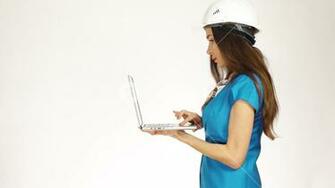 Worried Female Engineer Or Architect Wearing Had Hat Uses The