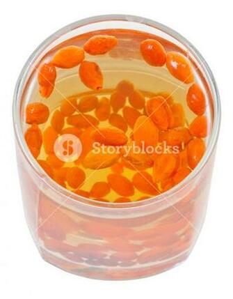 Preparing Of Goji Berry Tincture Above Glass With