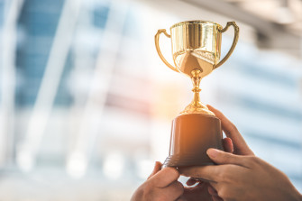 Champion Golden Trophy For Winner Background Wallpaper
