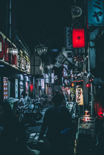 Person Standing Between Buildings Photo Tokyo Image On