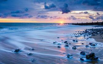 Rocks On A Sandy Beach Wallpaper