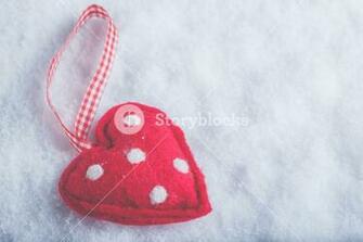 Red Toy Suave Heart On A Frosty White Snow Winter Background