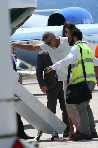 George Clooney Hobbles Onto Plane With Amal In First Sighting