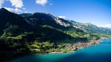 Landscape Photography Of Mountains Surrounded By Body Water