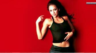 Jessica Alba Looking In Black Dress And Red Background Wallpaper