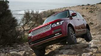 Red Range Rover Climbing Rocks Wallpaper