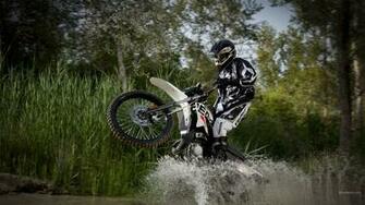 Derbi Dirtbike Wheelie Water Wallpaper