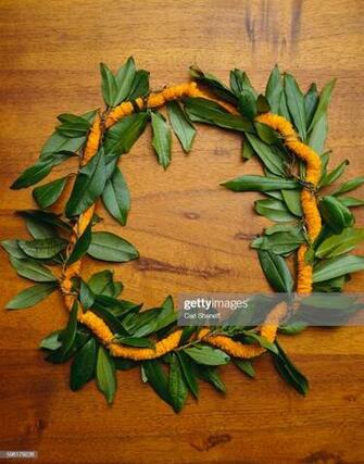 Maile Ilima Lei On Koa Wood Background Stock Photo