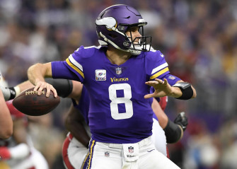 Kirk Cousins In Action Mid Toss Moment Wallpaper