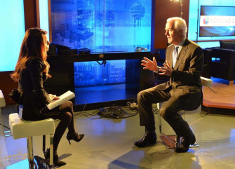 John Cornyn Being Intered By A Woman Wallpaper