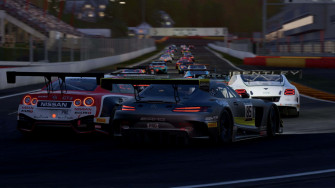 A Race Car Is Driving Down Track Wallpaper