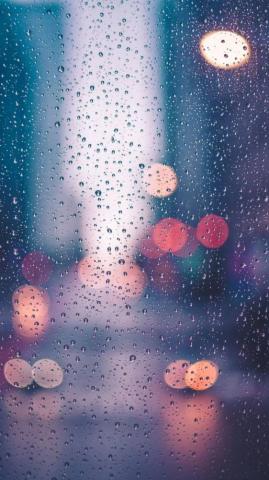 Wallpaper Of Water Drops With Lighting Reflections On Window