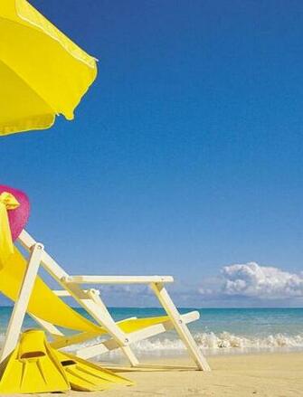 Summer Time Chair On The Beach