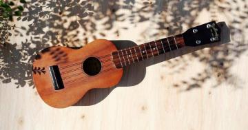 Holding Onto A Dream Playing The Ukulele By Campfire