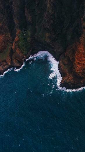 Crashing Waves On A Rough Dark Cliff Edge Photography