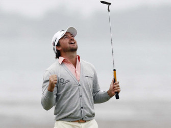 Loren Roberts Swinging With Precision On The Golf Course Wallpaper