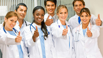 A Group Of Doctors Giving Thumbs Up Wallpaper